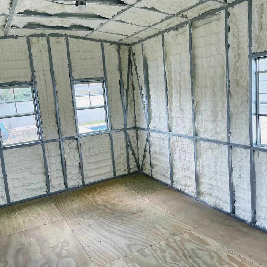 Closed-cell spray foam insulation applied to wall cavities in a residential project in Flatwoods